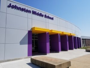 Photo of the exterior front doors of Johnston Middle School