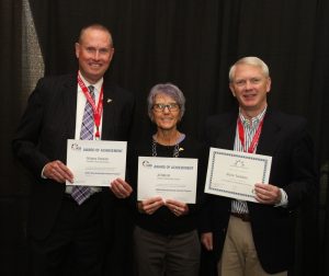 JCSD school board members Greg Dockum, Jill Morrill, and Mark Toebben with their awards from the IASB conference. 