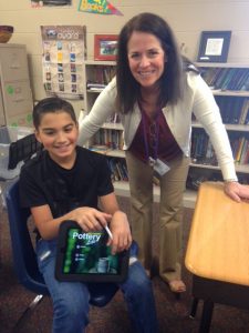 Summit teacher Nancy Ellis and a student with their new ipad