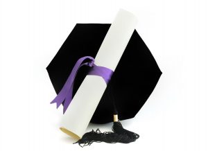 Stock photo of a diploma and cap.