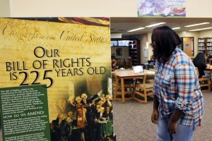 JMS student looking at the Bill of Rights display.