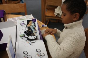 A Wallace elementary students tinkers with a Little Bits kit. 