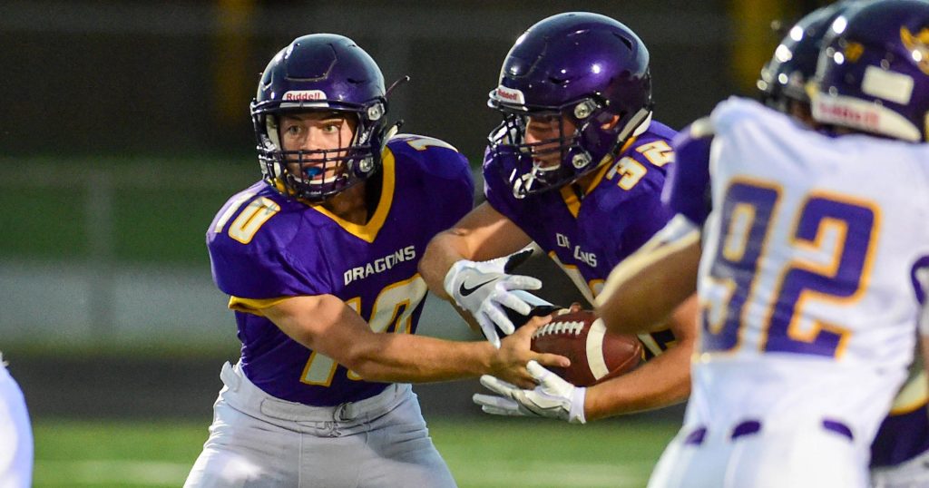 Johnston football players look to make a play during a game.