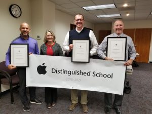 From left, JHS principal Ryan Woods, JCSD Instructional Technology Coordinator Ann Wiley, JMS principal Brent Riessen, and SMS principal Chris Billings accept Apple Distinguished School awards for their 1:1 iPad programs.