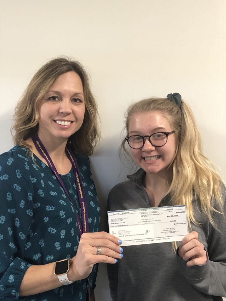 JHS junior Addie May accepts a $500 award as the 2019 JHS Financial Literacy Student of the Year. Shown with her is JHS business teacher Kayla Bousum.