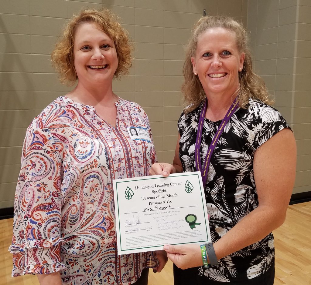 Huntington Learning Center director Cindy Clefisch presents JHS science teacher Danielle Pippert with her Teacher of the Month award. 