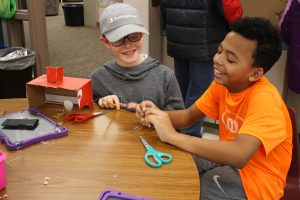 Fifth graders in Dan Loy's class work together to build an arcade game, just one of the hands-on learning units Loy incorporates into his curriculum. 