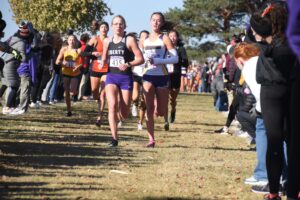 Young women racing in a cross country race